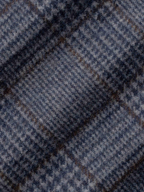 Blue and brown plaid blazer fabric with diagonal weave pattern and textured wool material.