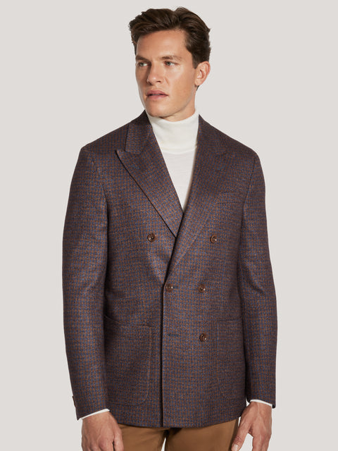 Double-breasted blazer with cognac and blue houndstooth pattern and brown buttons.