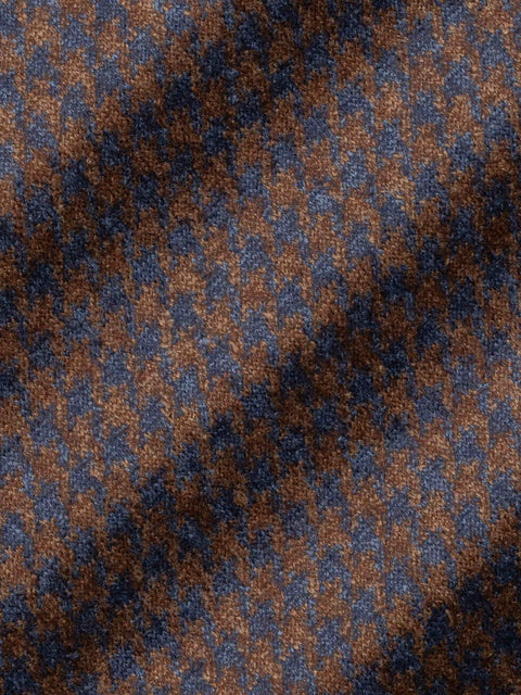 Cognac and blue houndstooth weave pattern on wool fabric with textured surface.