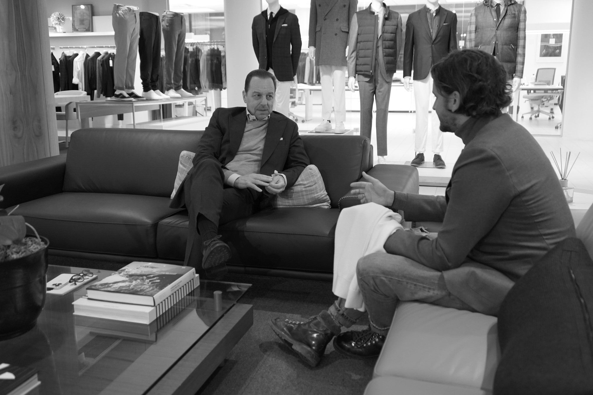 two men sitting down talking in the Jack Victor studio