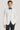 Cream dinner jacket with shawl collar worn with black bow tie and white dress shirt.
