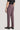 Dusk purple flat-front trousers with plain weave fabric, shown from side view on model wearing black shoes.