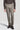 Light brown single pleat trouser with straight leg fit, shown with dark sweater and black shoes.