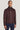 Burgundy Harrington jacket with collar, front zip, and long sleeves worn with navy trousers.