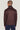 Burgundy Harrington jacket with black ribbed collar, shown from back on model wearing navy pants.