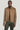Tan Harrington jacket with wide collar and front zip closure, worn over black shirt and olive pants.
