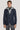 Navy blazer with detachable grey hooded bib and single button closure.