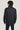 Dark gray denim shirt jacket shown on model from back, featuring long sleeves and button-front closure.