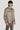 Beige wool shirt jacket with collar, button front, and chest pockets worn over blue t-shirt.