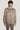 Beige wool shirt jacket with collar, zip front, and chest pockets worn by model.