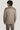 Beige wool shirt jacket with long sleeves and collar, shown on model from back view.