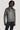 Mid grey Harrington jacket with front zip closure and collar, worn with navy trousers.