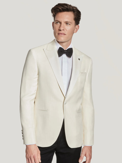 Cream herringbone dinner jacket with notch lapels, worn with white dress shirt and black bow tie.