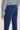 Royal blue stretch chino pants with flat front and back pocket detail, shown on model from waist down.