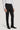 Man wearing black tuxedo trousers with white dress shirt and black formal shoes.