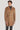 Camel wool coat with double-breasted button front, notch lapels, and flap pockets.