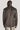 Brown sport jacket with notch collar and button cuffs, shown from back view on model.