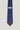 Navy tie with white polka dots and brown pointed tip, Jack Victor brand label visible.