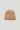 Camel-colored ribbed knit beanie with folded cuff on neutral background.
