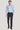 Man wearing light blue long-sleeve dress shirt with micro geoprint pattern and dark navy trousers.