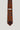 Terracotta tie with navy and white geometric square pattern throughout, dark burgundy tip, Jack Victor label visible.