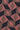 Tie fabric with geometric diamond pattern in rose pink, navy blue, and gold tones with textured weave.