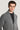 Charcoal cardigan with shawl collar and button front, worn over black t-shirt.