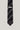 Dark tie with diagonal chevron pattern in silver and taupe stripes, Jack Victor label visible.