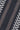 Navy tie with white and tan chevron stripe pattern in woven fabric texture.