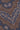 Brown and blue tie with paisley and geometric pattern in cream and white.