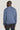 Blue crewneck sweatshirt with ribbed cuffs and hem worn by a man, shown from back view.