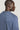 Blue crewneck sweatshirt with ribbed texture, shown from back view on model.