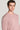 Man wearing a pink crewneck sweatshirt with ribbed knit texture.