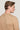 Beige crewneck sweater with textured knit pattern, shown from back on model.