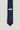 Navy blue tie with small white pin dots throughout and dark brown tip.