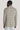 Tan and grey plaid blazer with notch lapels and long sleeves, shown on model from back view.