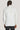 Cream double breasted dinner jacket with peak lapels and button cuffs, shown from back view on model.