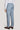Blue-grey single pleat trouser with flat front, worn with white shirt and brown leather shoes.
