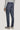 Navy denim melange tailored trouser with side fasteners, shown from back on model wearing gray sweater.