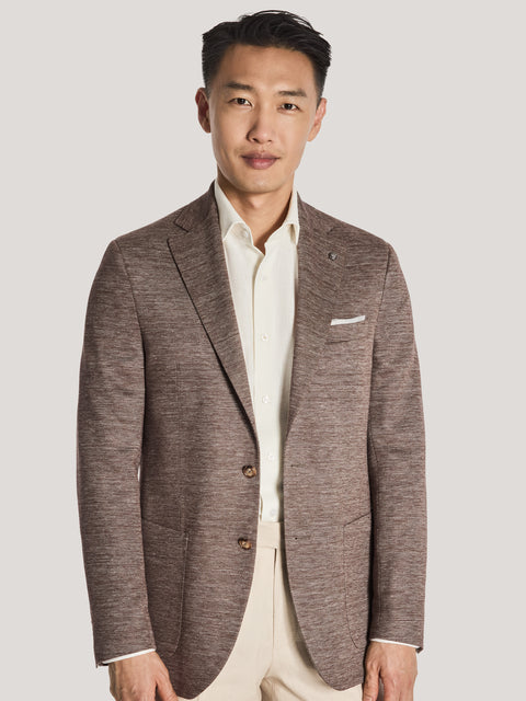 Brown melange blazer with notch lapels, two-button front, and chest pocket worn over cream shirt.