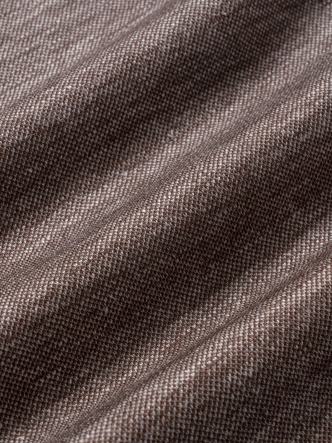 Brown melange woven fabric with textured surface and diagonal seams.