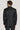 Black paisley dinner jacket with notch lapel and button cuffs, shown from back view on model.